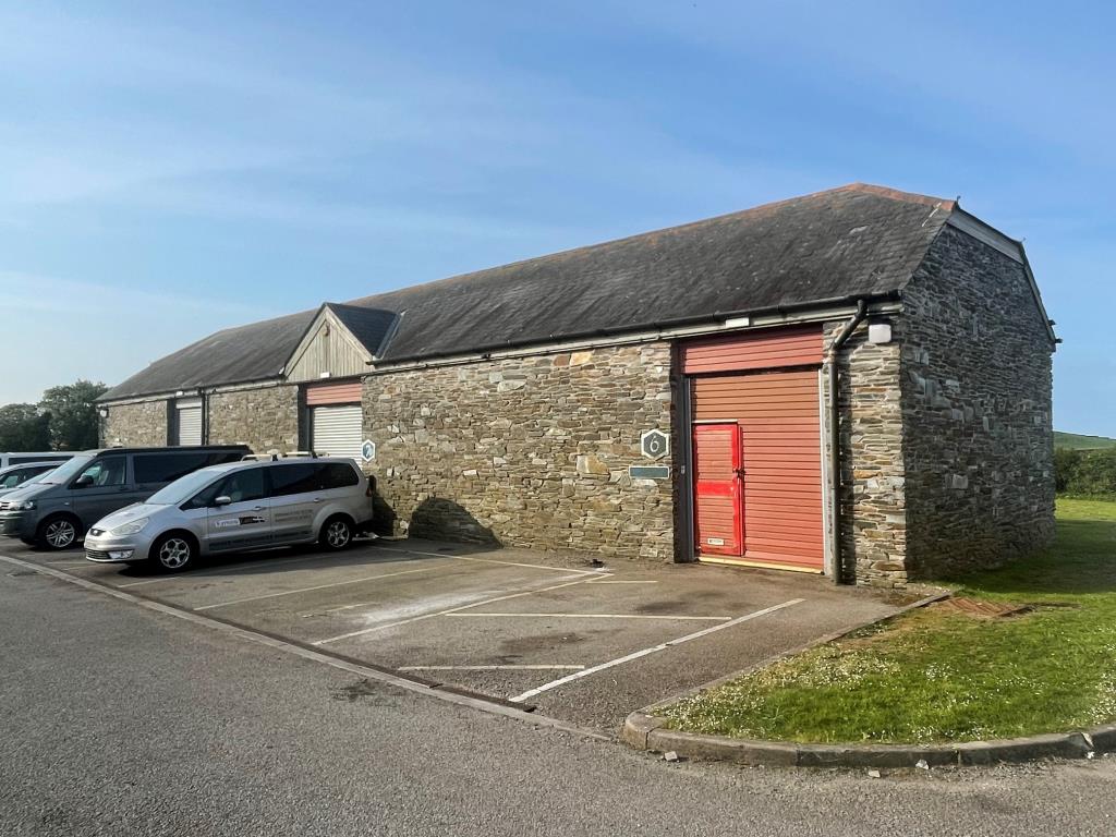 Lot: 80 - FREEHOLD BUSINESS PARK FOR INVESTMENT - Exterior photo showing terrace comprising units 6, 7 and 8